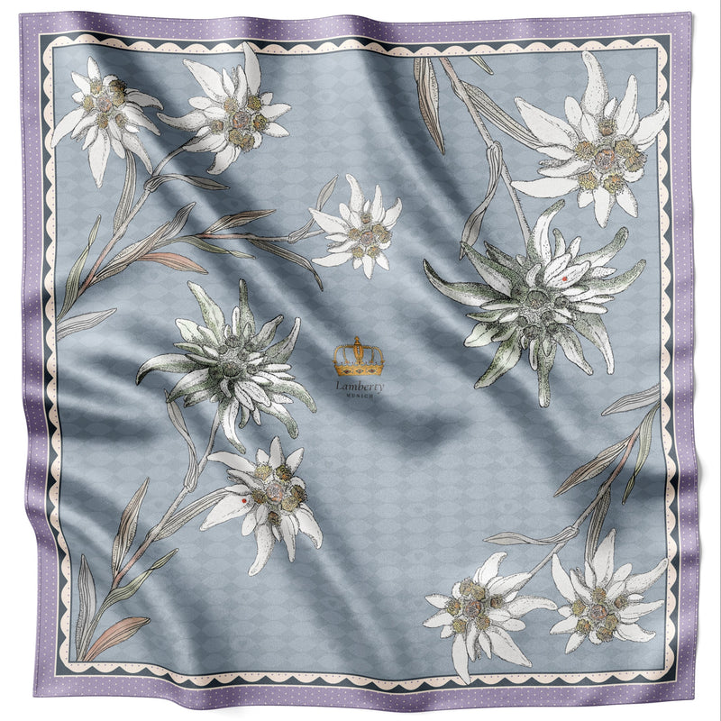 Blaues Edelweiss Alpenglow Seidentuch 70 × 70 cm flach ausgelegt mit Kronenmotiv und Bordüre