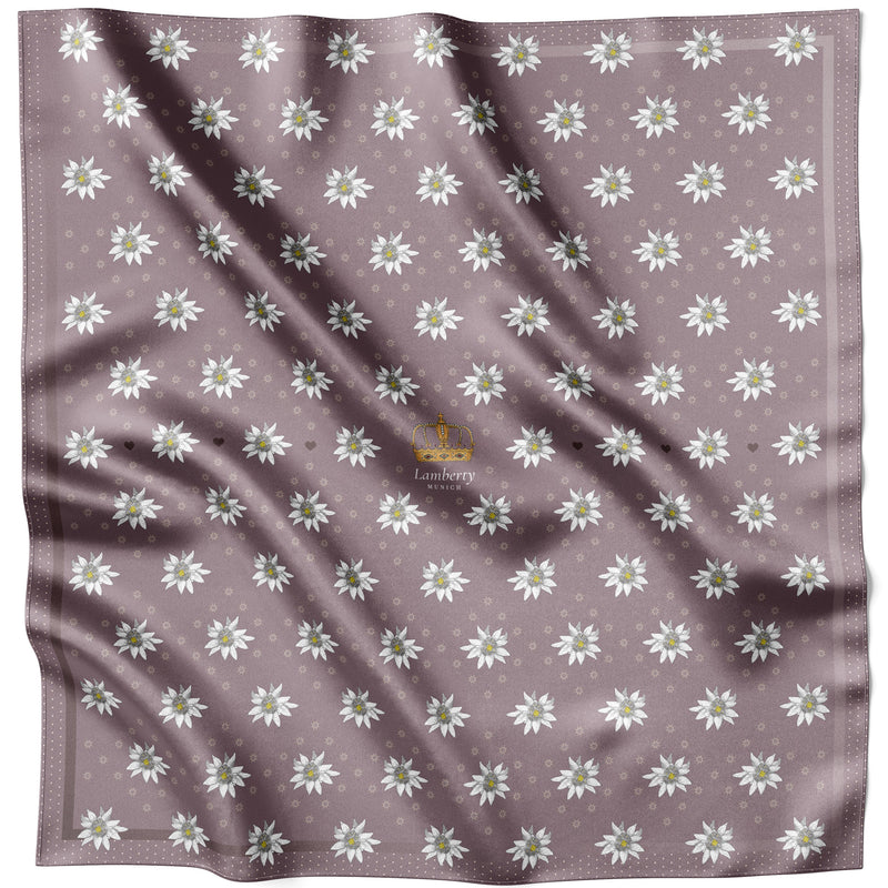 Violettes Alpine Edelweiss Seidentuch 70 × 70 cm flach ausgelegt auf mauvefarbenem Grund