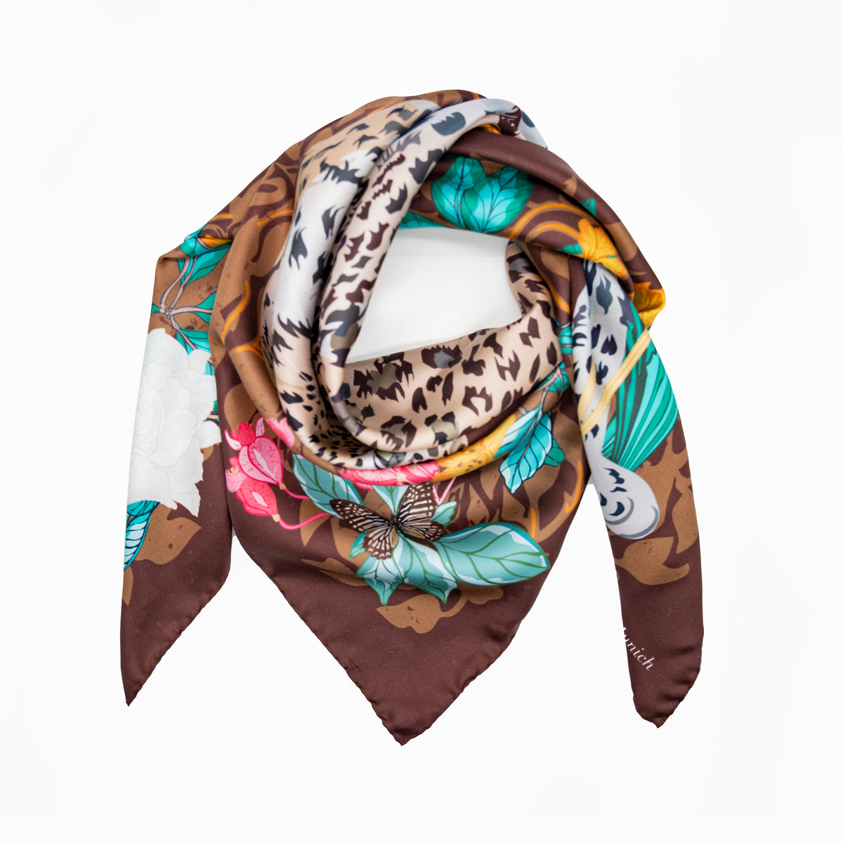 Brown Leopard in Jungle Motif silk scarf laid in a wide loop against a white background