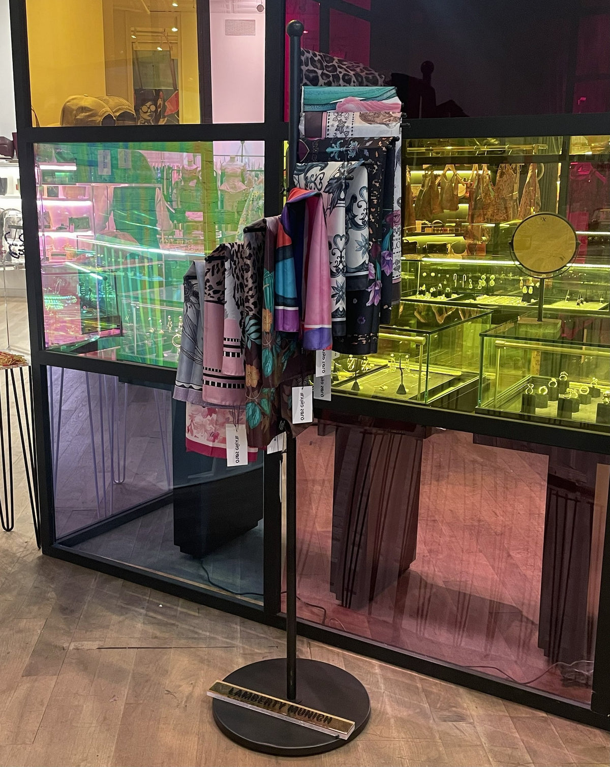 Lamberty Munich silk scarves on a display stand in a shop